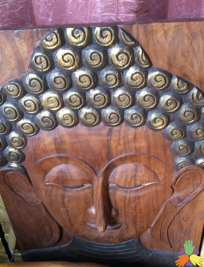 Buddha Face on Wood Plank
